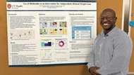 Psychiatry resident presents a poster at research conference.