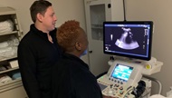 Ultrasound service members practice right upper quadrant sonography techniques. 