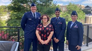 The Program Director, Associate Program Director, Program Coordinator and a recent graduate on the Riverwalk after the SAUSHEC graduation ceremony. 