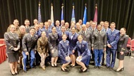 Interns pose with the associate program directors and program director at the 2023 graduation ceremony. 