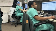 Two urology residents working at their desk. 