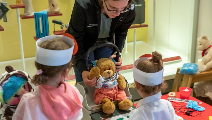 Image of Walter Reed National Military Medical Center pediatric residents and Uniformed Services University of Health Sciences medical students teach children about vitals and immunizations during the Sept. 23, 2023, Teddy Bear Clinic at the National Museum of Health and Medicine in Silver Spring, Maryland. (NMHM photo by Ian Herbst).