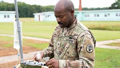 Military personnel taking data