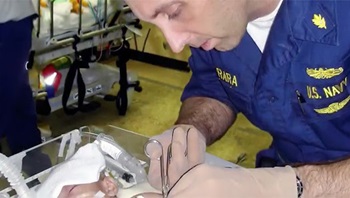 Dr. Stephen Ferrara working on a patient