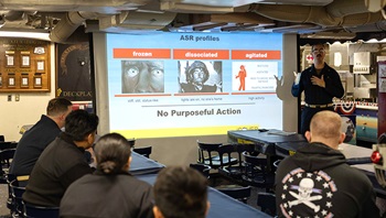 Lt. Aaron Vandyne, back right, a psychiatrist assigned to Navy Medical Center Portsmouth, gives sailors “identify, connect, offer, verify, establish, and request” training