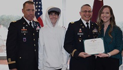 U.S. Army Col. Matthew Mapes, the Evans Army Community Hospital commander, far left, poses with U.S. Army Maj. Josha Goldberg, the department of education chief at EACH, his wife, Kaylanda Pinkerton, the chief nurse for the Mountain Post Birthing Center, and their son, Ryder, during Goldberg's Soldiers Medal ceremony