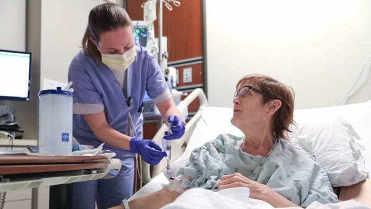 Image of Military nurse tends to patient.