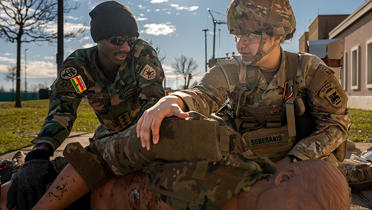 Ghana Armed Forces Capt. Emmanuel Oti Boateng and U.S. Army Spc. Danielle Soberanis, a medic assigned to U.S. Army Southern European Task Force Africa, assess a simulated casualty during the partner medical training exercise