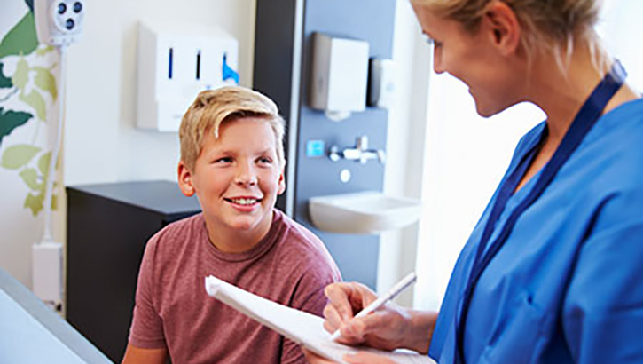 Image of Doctor talking to a boy.