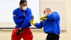 Boxer and Military personnel during a Human Performance Seminar