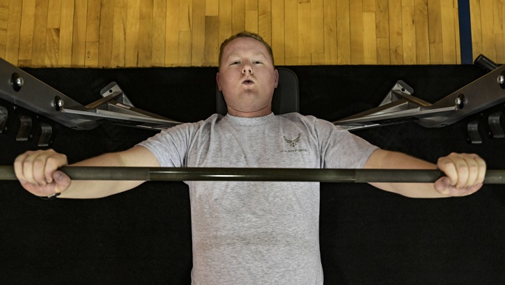 Image of Military personnel working out at the gym.