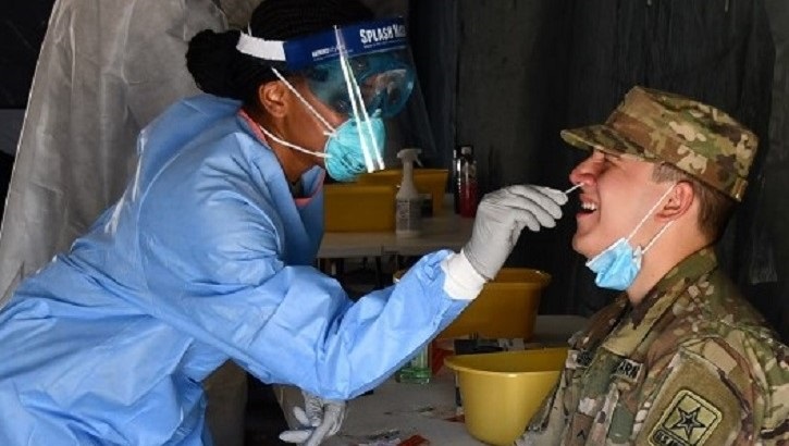 Image of Army soldier gets nose swab.