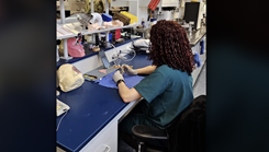 A military medical student works in a library