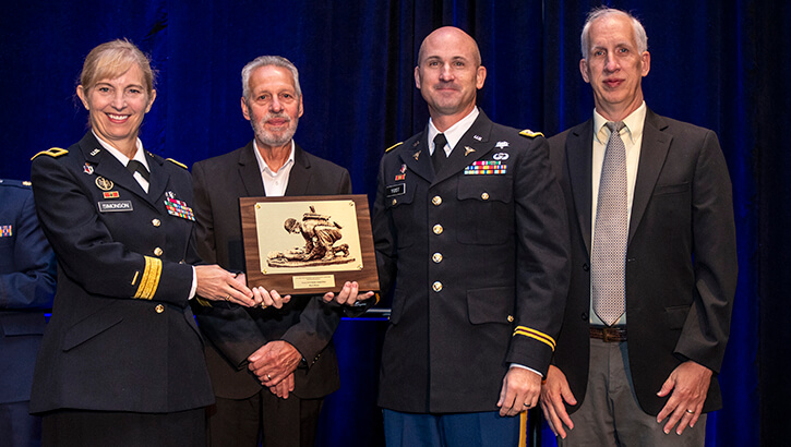 Image of A group of people with an award.