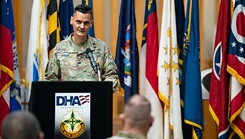 Col. (Dr.) Jonathan Craig Taylor speaking at podium