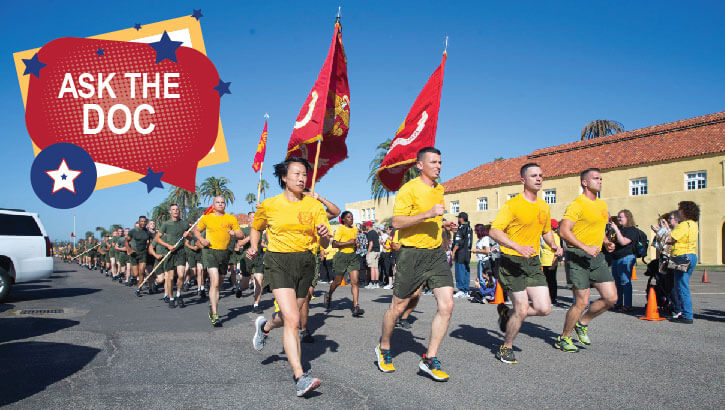 Image of Marine Corps recruits run in formation.