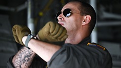 A member from the 302nd Airlift Wing signals to Airmen on the flightline at Peterson Space Force Base, Colorado, Sept. 4, 2024.