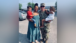 Staff Sgt. Jack Helton stands with his wife, Becca, and their children, Copelan, 2, and Haegan, 3, following his graduation from the U.S. Army recruiting school