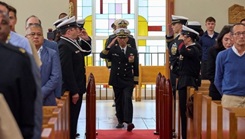 U.S. Navy Capt. Michael G. Mercado taking command during a ceremony held inside the Naval Station Rota Chapel