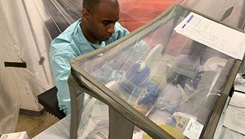 Military personnel working in a lab