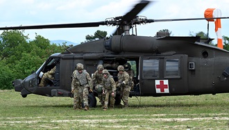 Link to Photo: Military personnel exiting a helicopter