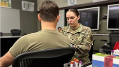 Sgt. Felicia Wells, a medical laboratory specialist assigned to Munson Army Health Center, Fort Leavenworth Kansas, collects a blood sample from a Soldier 