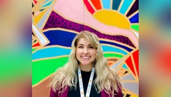 Sara Cantrell, a pediatric art therapist with the Walter Reed National Military Medical Center’s pediatric hematology oncology clinic, stands in front of the art cabinet. (Photo by James Black/Walter Reed National Military Medical Center)