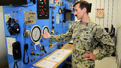 Military personnel demos compression chamber