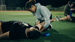 U.S. Navy Hospitalman Amy Pierre Pion, assigned to U.S. Navy Medicine Readiness and Training Command in Rota, Spain, applies a right upper limb torniquet to a simulated patient, during a combined physical training and tactical combat casualty care exercise.  (Photo by U.S. Navy Petty Officer 2nd Class Rigel Jamero/U.S. Naval Hospital Rota)