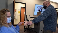 A tobacco cessation counselor with a patient