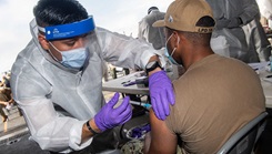 Military health personnel giving the COVID-19 Vaccine to military personnel