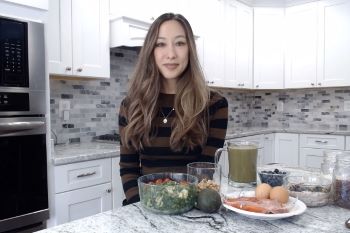 Military personnel posing in a kitchen