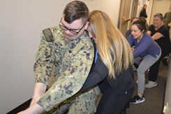 Ms. Teri Nyblom and her colleagues playing tug of war