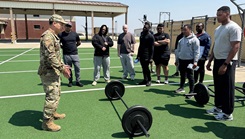 U.S. Air Force Staff Sgt. Koji Yoshioka, 51st Operational Medical Readiness Squadron physical therapist technician, demonstrates how to perform a conventional barbell deadlift during and outreach for Soldiers at Camp Humphreys, South Korea
