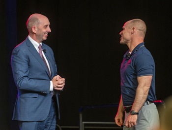 Dr. Stephen Ferrara, Acting Assistant Secretary of Defense for Health Affairs, thanks Dan Cnossen, a retired Navy SEAL and a Paralympian, for sharing his story