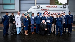 87th Air Base Wing personnel and Cooper University Hospital staff pose for a photo following the inaugural Air Force Paramedic Currency Platform graduation ceremony