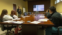 Leianne Pouliot, a licensed clinical social worker at Walter Reed National Military Medical Center, conducts a Peer Connect training for employees.