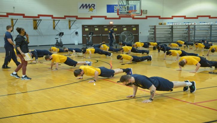 Image of Photo of group doing pushups.