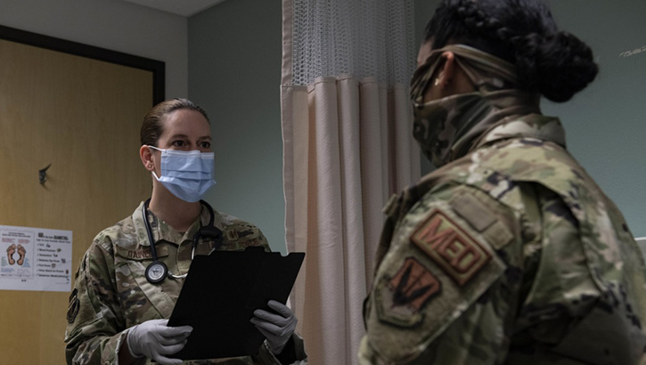 Image of Photo of two military women talking.