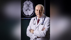 Dr. David Williamson, director of the Inpatient Neuropsychiatric and Traumatic Brain Injury ward and Brain Injury Medicine at Walter Reed National Military Medical Center, poses for a photo