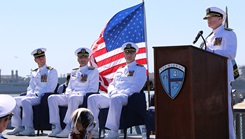 Retired Rear Adm. David Malone delivers the keynote address during Rear Adm. Frank Brajevic’s promotion ceremony aboard the USS Midway 