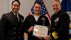 Military personnel with award