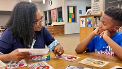 Dr. Joyce Hewitt, a licensed clinical social worker at Bayne-Jones Army Community Hospital, works with a student during a demonstration of school-based behavioral health services