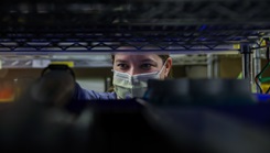 Air Force Maj. Megan George, a registered nurse assigned to the 633d Medical Group based at Joint Base Langley-Eustis, Virginia, retrieves medical supplies from a storeroom at Hennepin Healthcare in Minneapolis, Minnesota during COVID-19 response operations, Dec. 7. The DHA has seen early success in replacing deployed personnel in their assigned markets (Photo by Navy Petty Officer 2nd Class Michael H. Lehman).