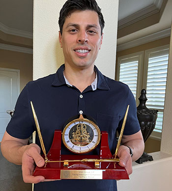 Military personnel with award