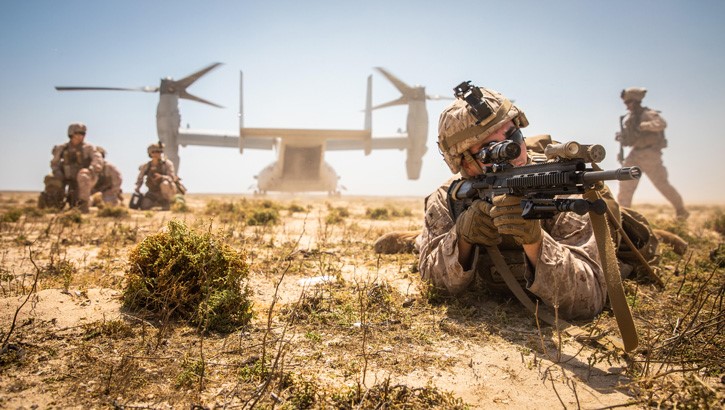 Image of A Marine posts security during an exercise on Karan Island, Kingdom of Saudi Arabia, April 23, 2020. .