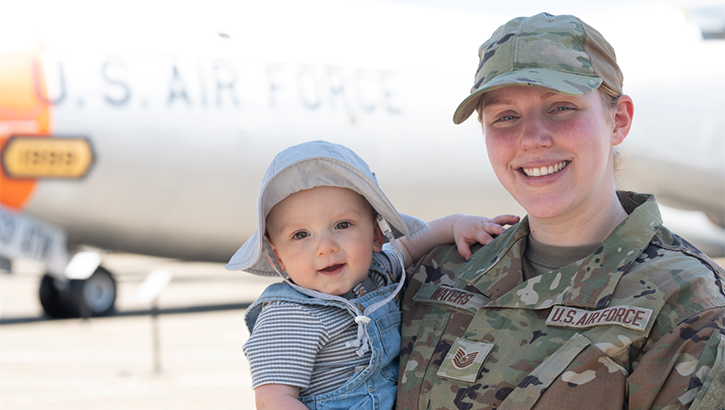 U.S. Air Force Tech. Sgt. Savannah Waters, 60th Air Mobility Wing public affairs specialist, smiles for a photo with her son in celebration of Mother’s Day