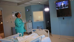 Blanchfield Army Community Hospital Intensive Care Unit Chief Nurse U.S. Army Maj. Brenda Mitchell preforms a communication check with a nurse at the Defense Health Agency Virtual Medical Operations Center at Naval Medical Center San Diego, California, using the Joint Tele-Critical Care Network, on March 27. (Photo by Justin Moeller, Blanchefield Army Community Hospital