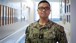 U.S. Navy Lt. j.g. JungHyun Seo posing for a picture