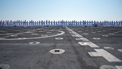 Sailors assigned to the Mercy-class hospital ship USNS Comfort (T-AH 20) man the rails during Comfort’s homecoming 